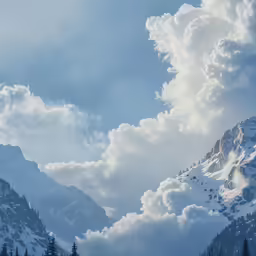 some snow mountains with clouds in the sky