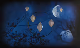 an abstract scene with leaves hanging from a pole