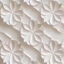 a white flower pattern covering a wall