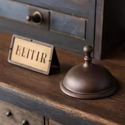 a wooden dresser with an old fashioned sign that says betir