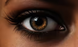 a person with brown eye and long black hair