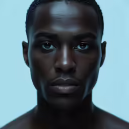 a man with black skin and an afro