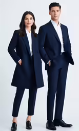 two people wearing dark blue blazers and white shirts