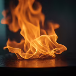 a close up of fire that has some orange and yellow flames