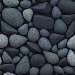 a pile of black rocks next to a red phone