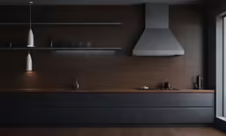 modern kitchen with brown counters and black cabinets