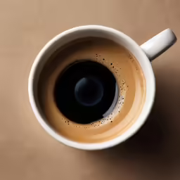 a coffee cup with the black center on it