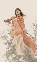 an asian woman in a red dress is flying