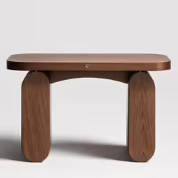 a brown wooden bench sitting on top of a white floor