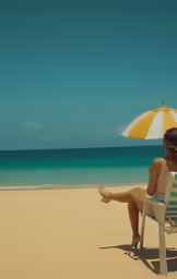a woman sitting on top of a beach under an umbrella