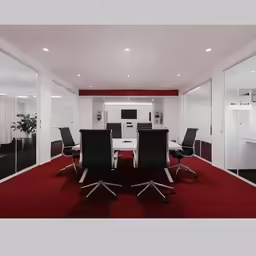 modern office with black and red chairs in glass walled space
