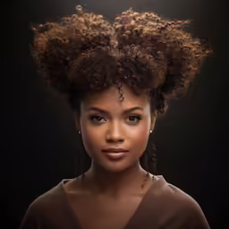 a woman has very big afro hair