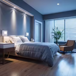 bedroom with hardwood floors and blue walls