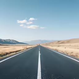 the road is straight and a line of white lines on the opposite side