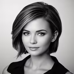 a woman with a short haircut wearing a dress