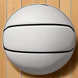 an over head shot of a basketball on the wood floor,a white basketball is hanging on the wall
