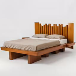 a bed that has two wooden drawers underneath it