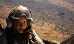 there is a girl that has a helmet and goggles