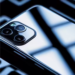 a close up of a cell phone with a blue and black background