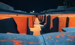 a bunch of seats that have orange walls on them
