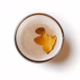 there is a cup with a liquid in it