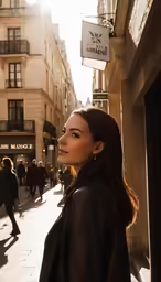 a beautiful young woman standing on the street