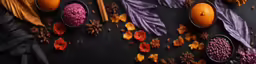 several oranges, leaves, and seeds are arranged to resemble feathers