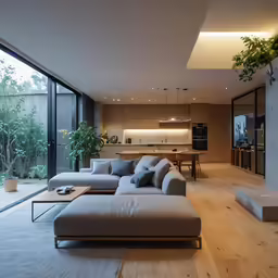 a living room and dining area with a large sofa