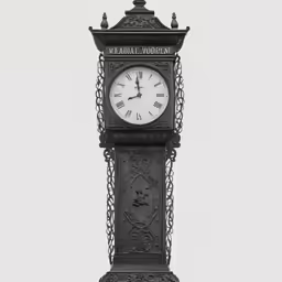 a small decorative clock on top of a metal stand