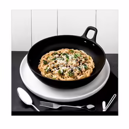 some noodles in a pan and a fork