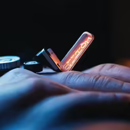 a picture of a cell phone in the dark