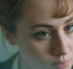 the beautiful young woman is holding her head up