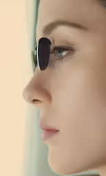 a young lady with eye glasses on