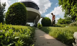 a man that is standing in the grass