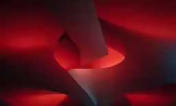 some light in the middle of a long red wall