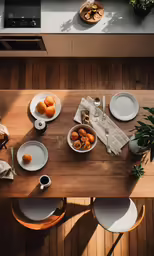 a wooden table with some plates and food on it