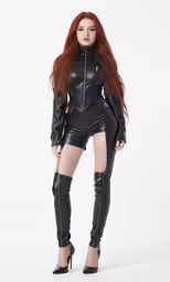 a beautiful woman dressed in black leather with tight stockings