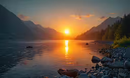 an image of a sunset over water from the shore