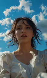 the girl in the white dress is staring upward