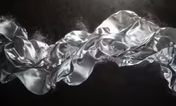a silver ribbon is blowing in the wind