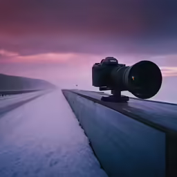 there is a long road that has snow on it