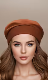 the woman is wearing a brown hat and brown lipstick