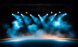 a stage that has three spotlights on it