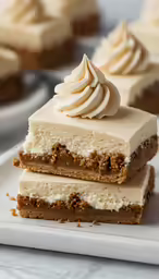 three pieces of dessert on a white plate