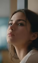 a young girl looks back over her shoulder