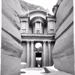 an old building has columns and arches on the side of it