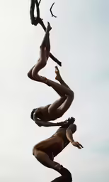 three naked men standing next to each other