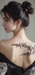 a woman with a tattoo on her back neck