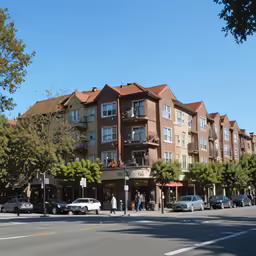 a city street with cars parked on the side and apartment buildings