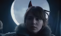 the girl in a dark fur collar stands in front of a full moon